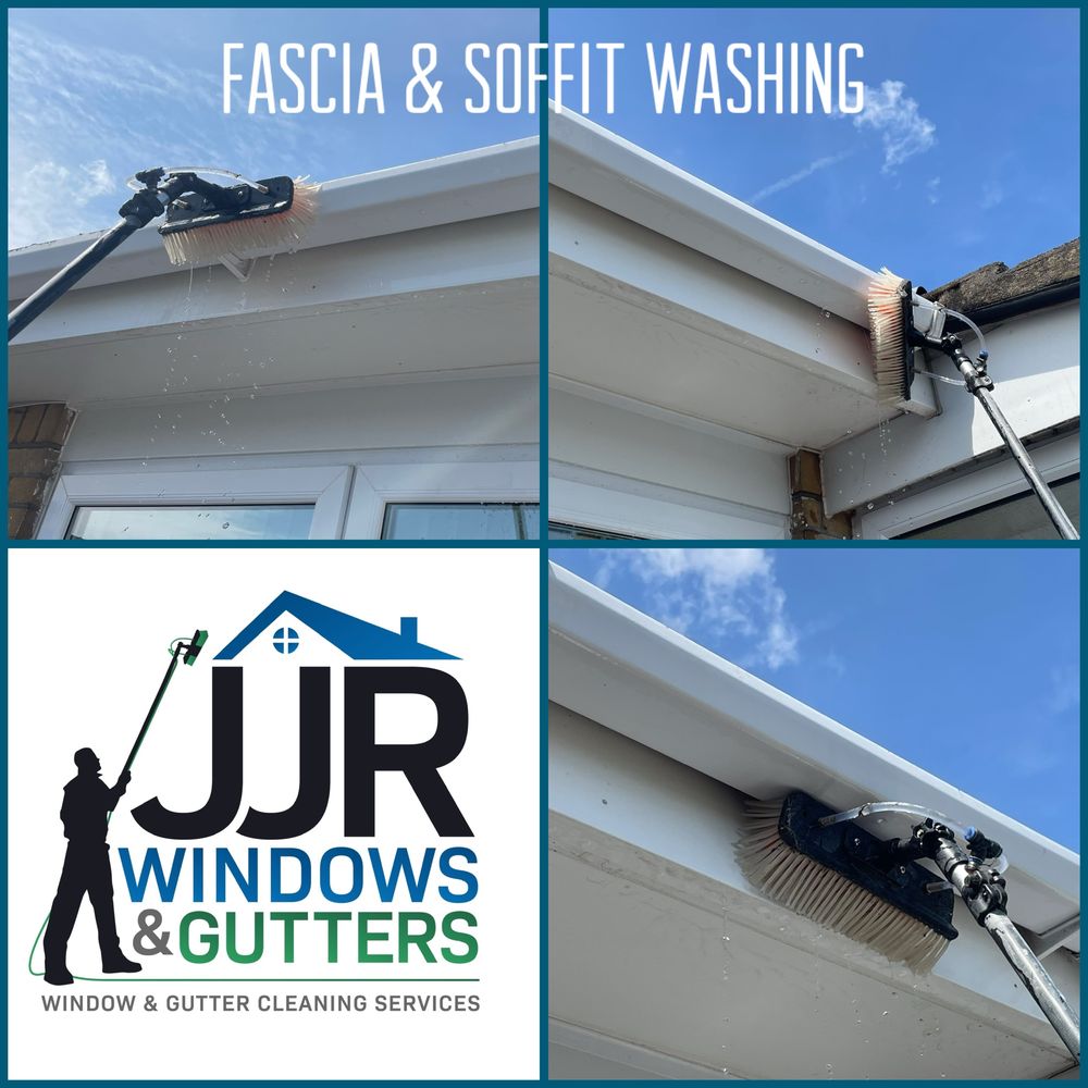 Fascia and soffit being washed with a pole-fed brush